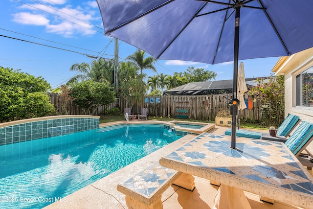 view of swimming pool featuring an in ground hot tub