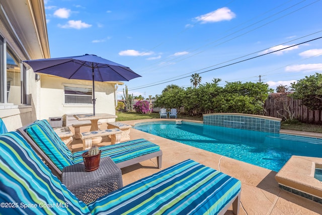 view of swimming pool with a patio