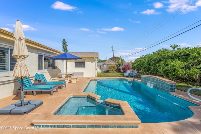 view of swimming pool with an in ground hot tub and a patio