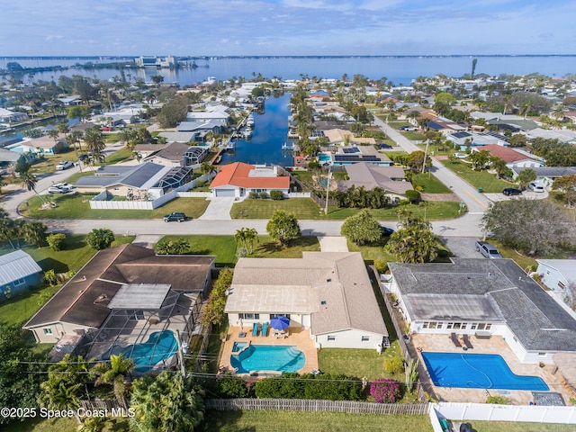 birds eye view of property featuring a water view