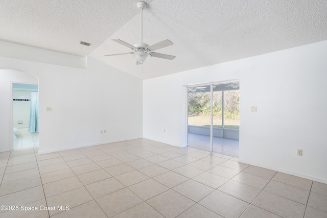 unfurnished room with light tile patterned flooring, a textured ceiling, and ceiling fan