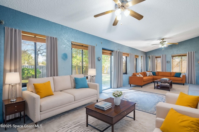 carpeted living room featuring ceiling fan, vaulted ceiling, and a textured ceiling