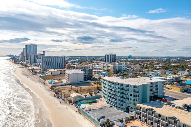 aerial view featuring a water view and a beach view