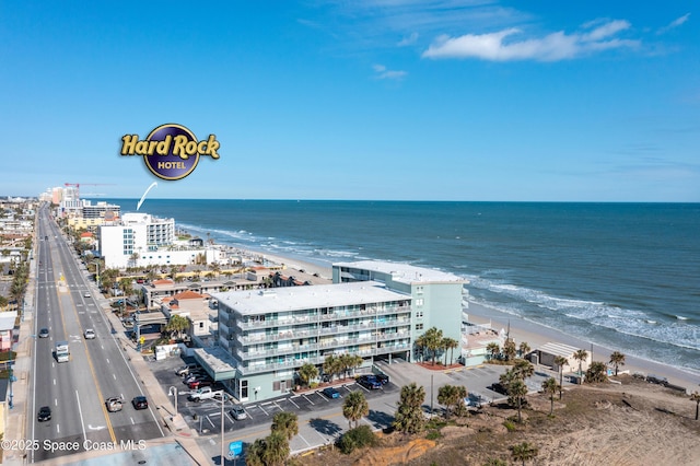 birds eye view of property with a view of the beach and a water view