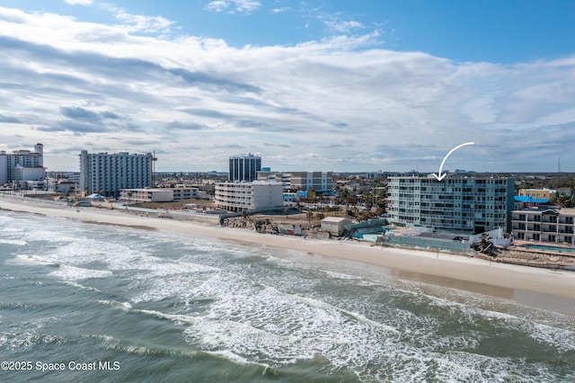 bird's eye view featuring a beach view and a water view