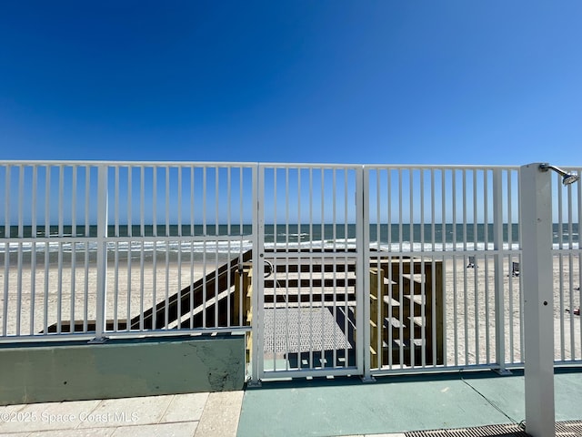 800 N Atlantic Ave Unit 705, Daytona Beach, FL 32118 - view of gate with a water view and a beach view