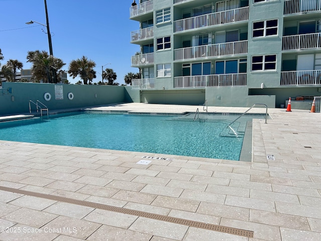 800 N Atlantic Ave Unit 705, Daytona Beach, FL 32118 - pool with a patio and fence