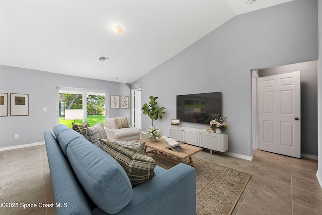 tiled living room with lofted ceiling