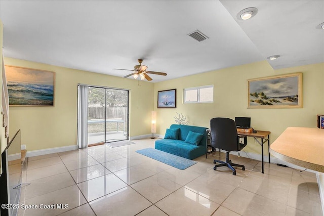 office area featuring light tile patterned floors, baseboards, visible vents, and ceiling fan