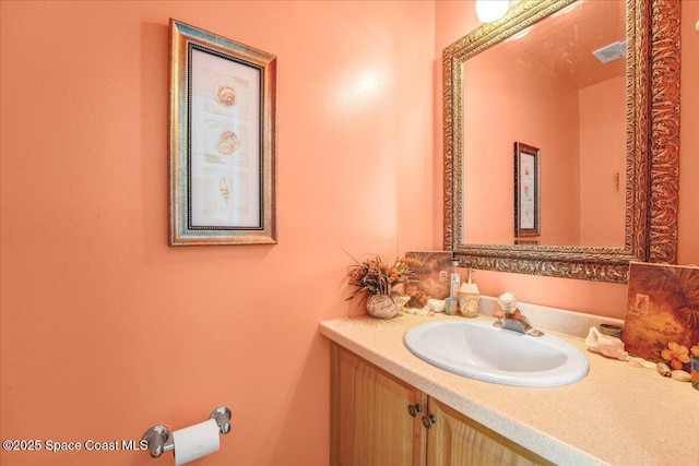 bathroom featuring visible vents and vanity