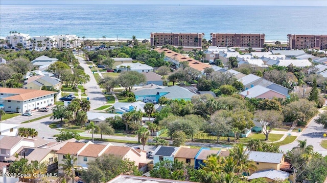 birds eye view of property with a water view and a residential view