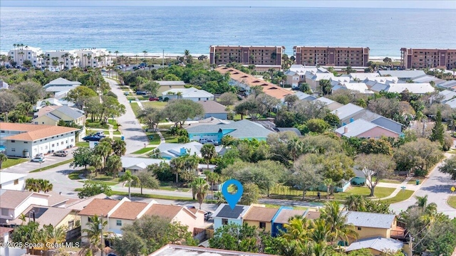 drone / aerial view with a water view and a residential view