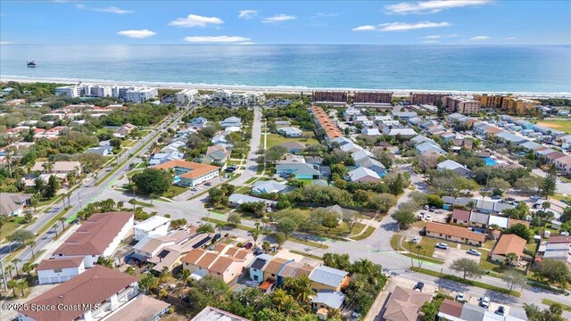 birds eye view of property with a water view and a residential view