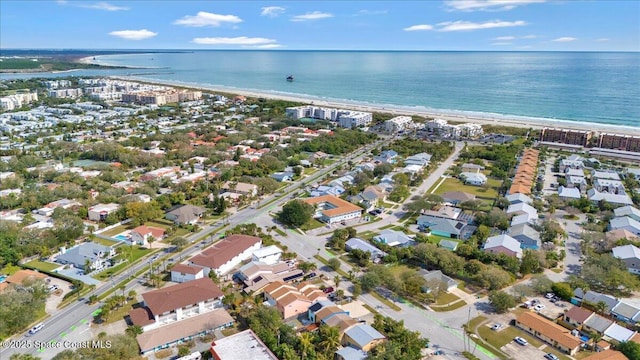 drone / aerial view featuring a residential view and a water view