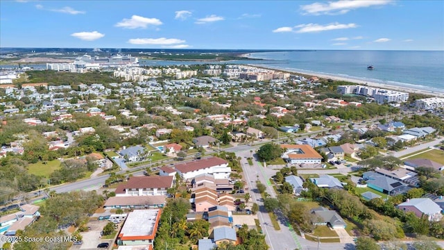 bird's eye view featuring a water view and a view of the beach