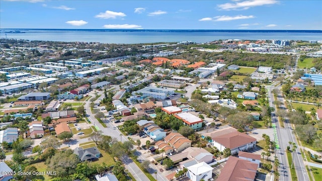 birds eye view of property with a water view and a residential view