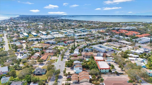 drone / aerial view with a water view and a residential view