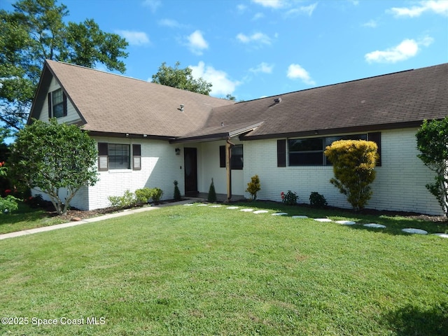 single story home featuring a front yard