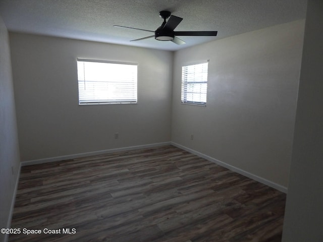 unfurnished room with dark wood-type flooring, a textured ceiling, and ceiling fan