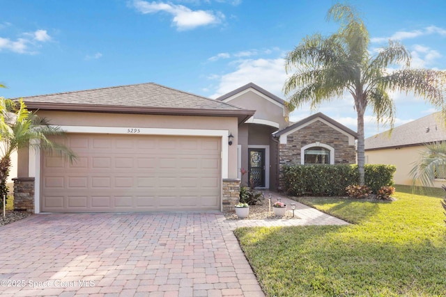 view of front of property with a garage and a front yard