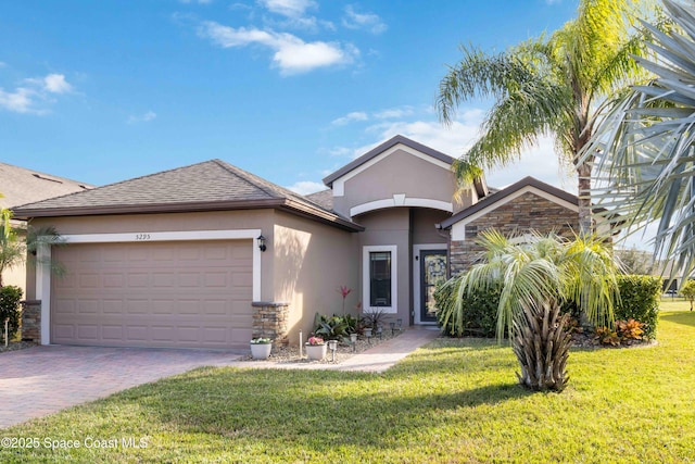 view of front facade with a garage and a front lawn