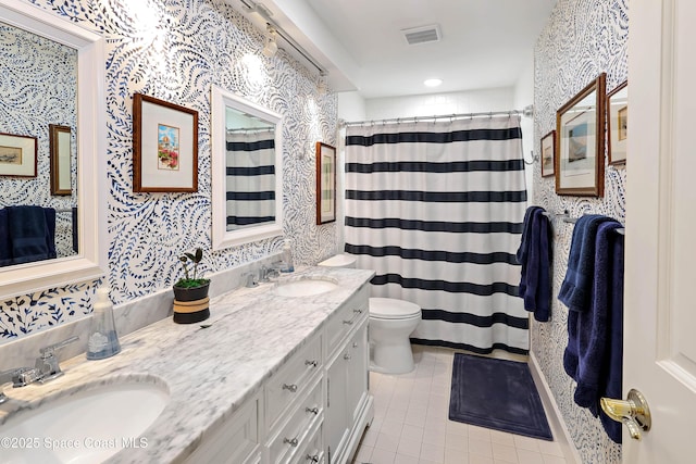 bathroom featuring vanity, toilet, curtained shower, and tile patterned flooring