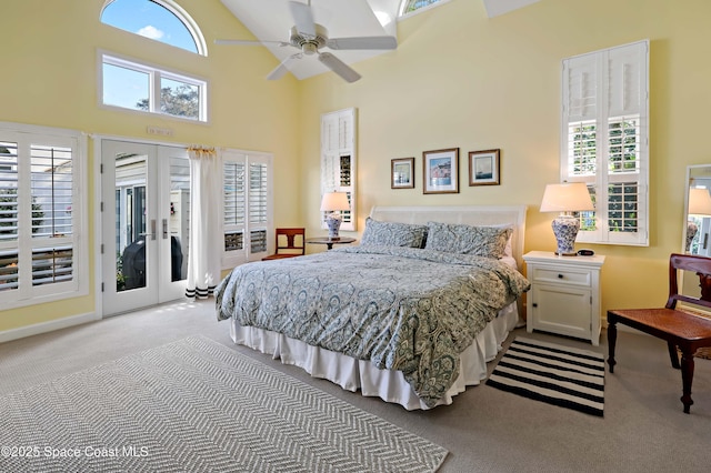 carpeted bedroom featuring access to outside, high vaulted ceiling, french doors, and ceiling fan