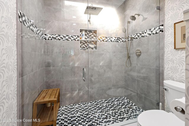 bathroom with toilet and walk in shower
