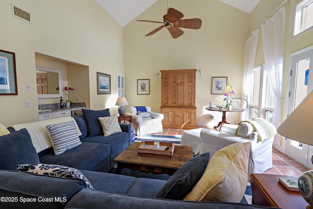 living room featuring plenty of natural light and high vaulted ceiling