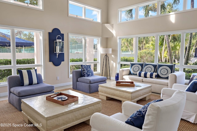living room featuring a high ceiling