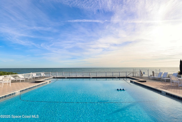 view of pool featuring a water view