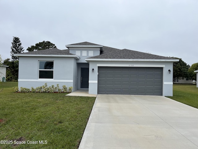 prairie-style home with a garage and a front lawn