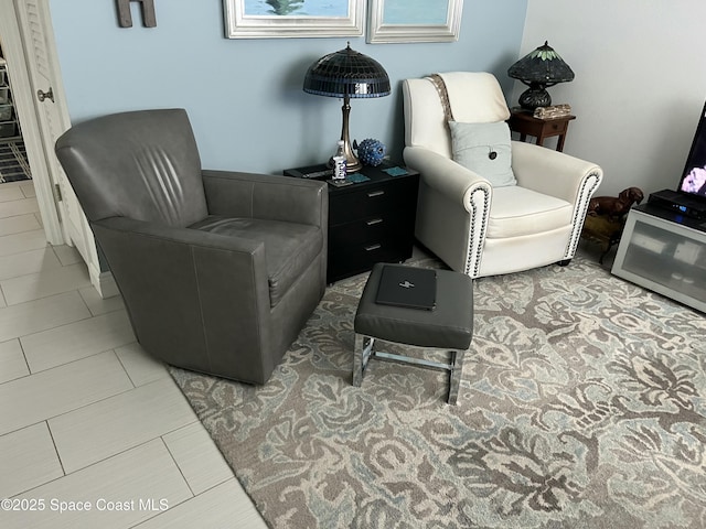 living area with tile patterned flooring