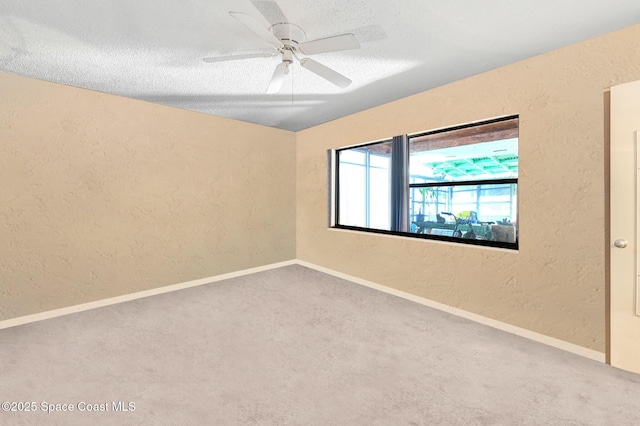 spare room featuring ceiling fan and a textured ceiling