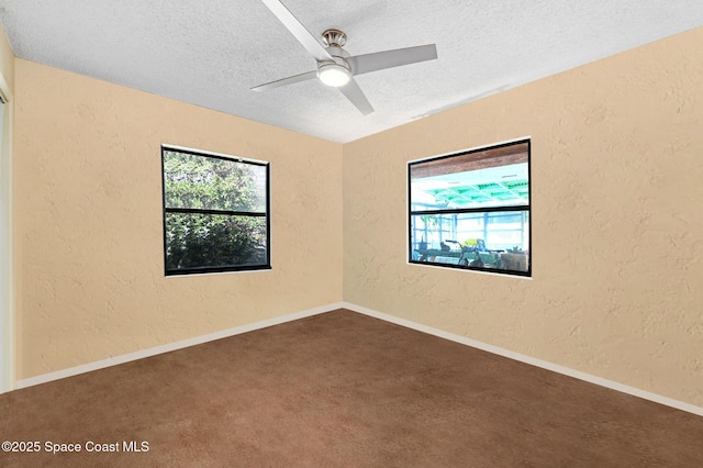 unfurnished room featuring ceiling fan, plenty of natural light, and a textured ceiling