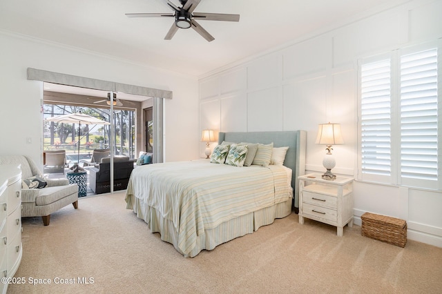 bedroom featuring ceiling fan, ornamental molding, light carpet, and access to outside