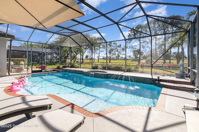 view of pool featuring a patio area, an in ground hot tub, pool water feature, and glass enclosure