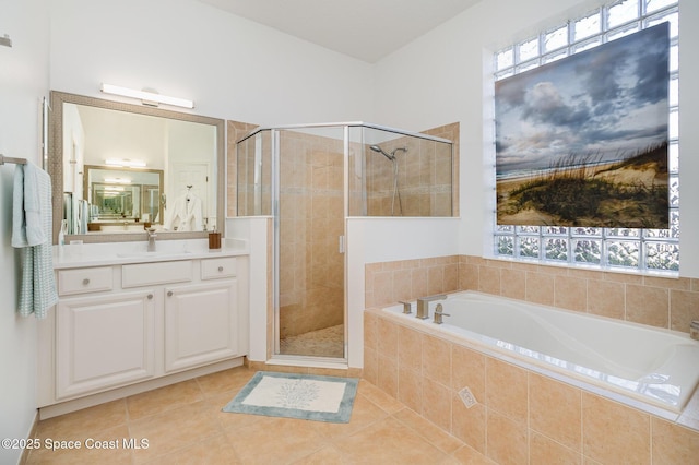 bathroom with tile patterned flooring, vanity, and independent shower and bath