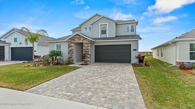 view of front of home featuring a garage and a front lawn