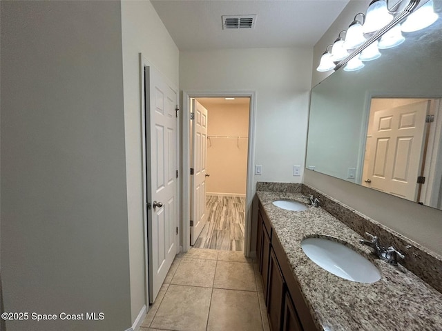 bathroom featuring tile patterned floors and vanity