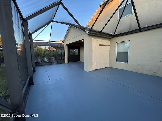 view of patio with a lanai