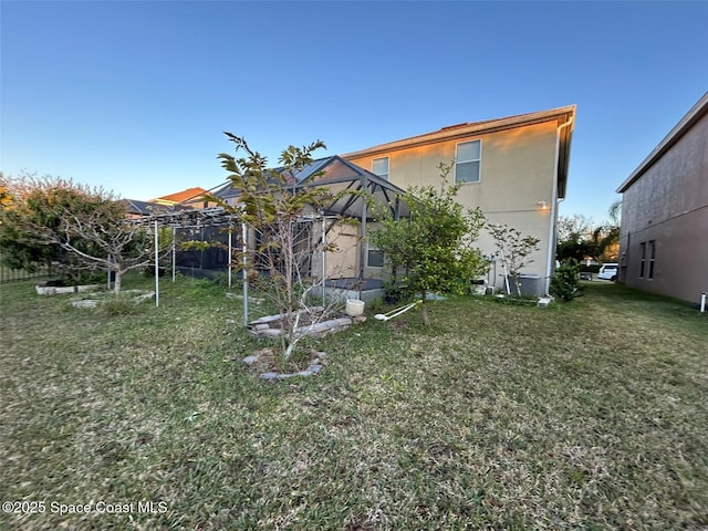 rear view of property with a yard