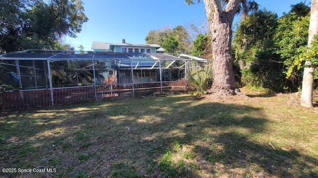 view of yard with a lanai