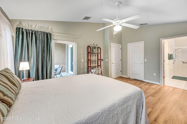 bedroom featuring lofted ceiling, connected bathroom, light hardwood / wood-style floors, and ceiling fan