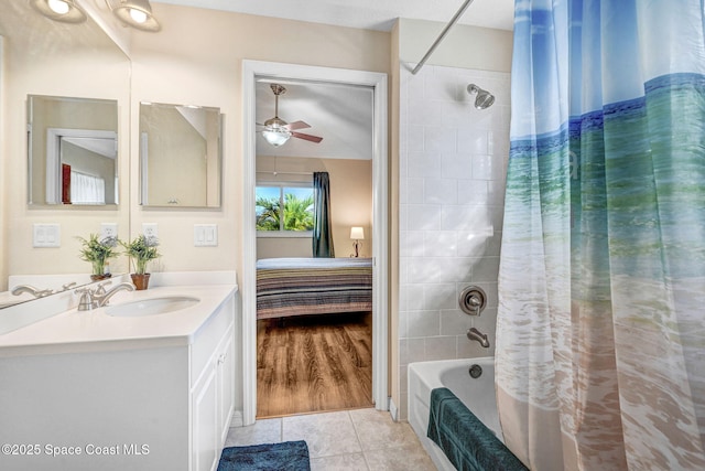 bathroom with tile patterned flooring, vanity, shower / bath combination with curtain, and ceiling fan