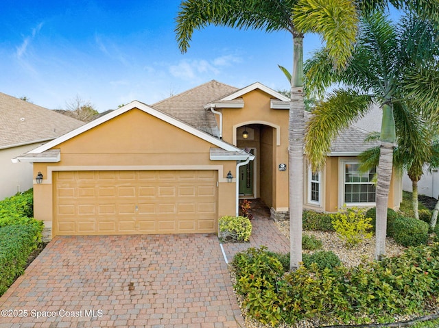 view of front of property with a garage