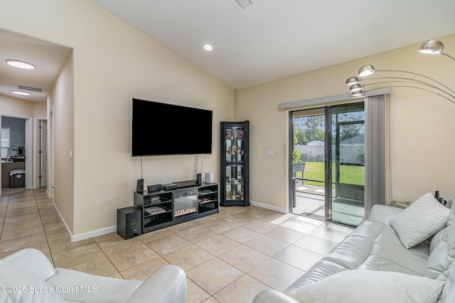 tiled living room with vaulted ceiling