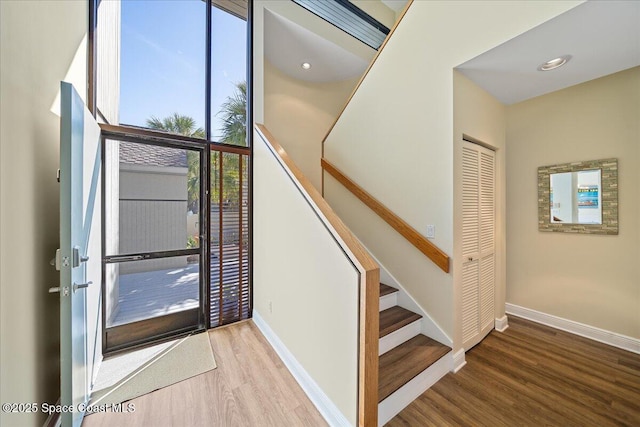 staircase with wood-type flooring