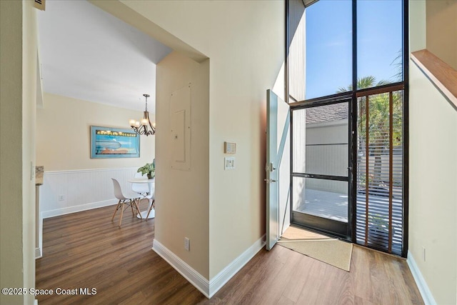 interior space featuring hardwood / wood-style flooring and a chandelier