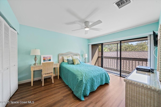 bedroom featuring dark hardwood / wood-style flooring, access to outside, a closet, and ceiling fan